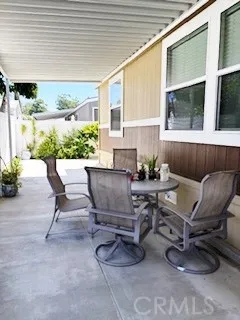 24922 Muirlands Lake, Unit 115 Lake Forest, CA 92630 - Photo 16 of 17 a living room with furniture and a potted plant