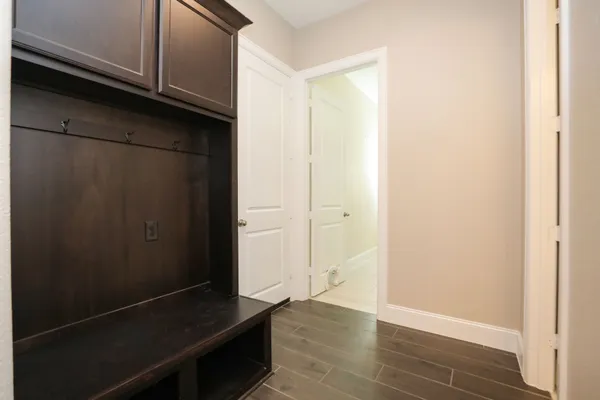 an empty room with wooden floor