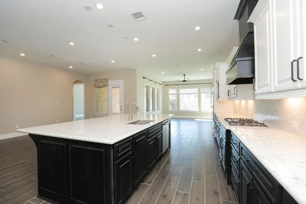 a kitchen with a stove and a sink