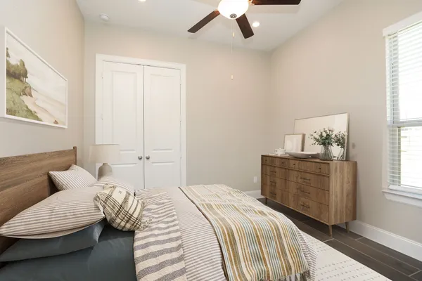 a bedroom with a bed and a window