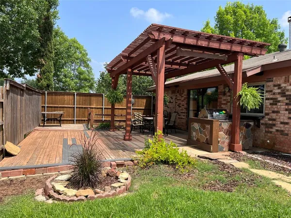 a view of a backyard with swimming pool