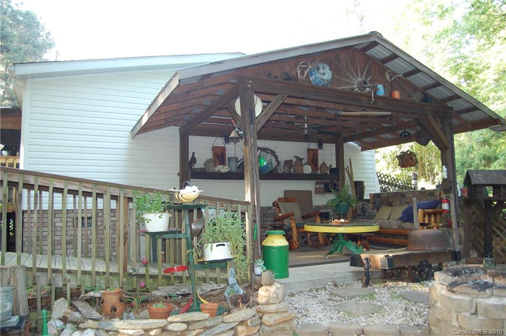 157 Green Road Star, NC 27356 - Photo 7 of 7 a view of a patio with a table and chairs under an umbrella