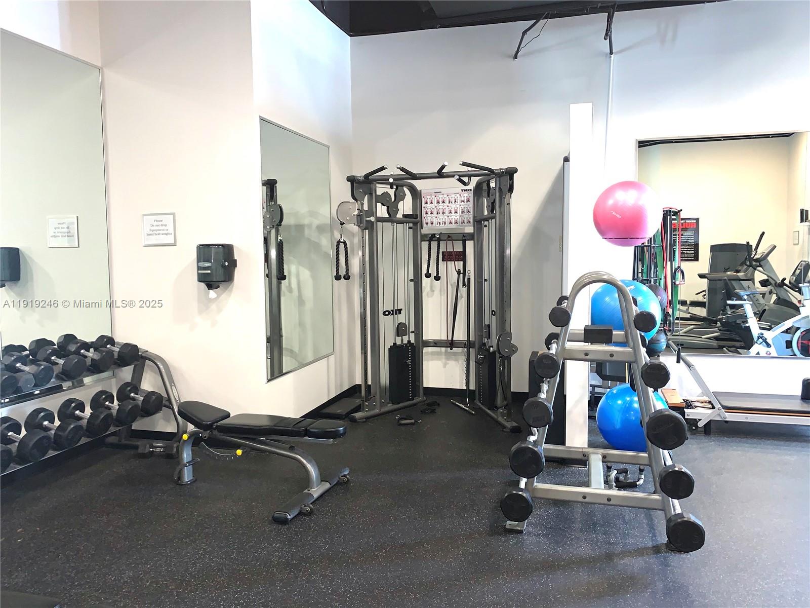 2001 Meridian Avenue, Unit 330 Miami Beach, FL 33139 - Photo 16 of 19 a view of a room with gym equipment