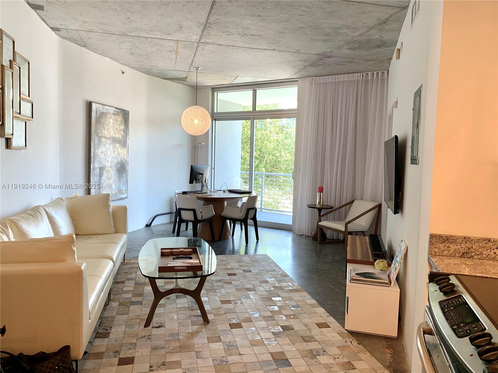 2001 Meridian Avenue, Unit 330 Miami Beach, FL 33139 - Photo 4 of 19 a living room with furniture and a window