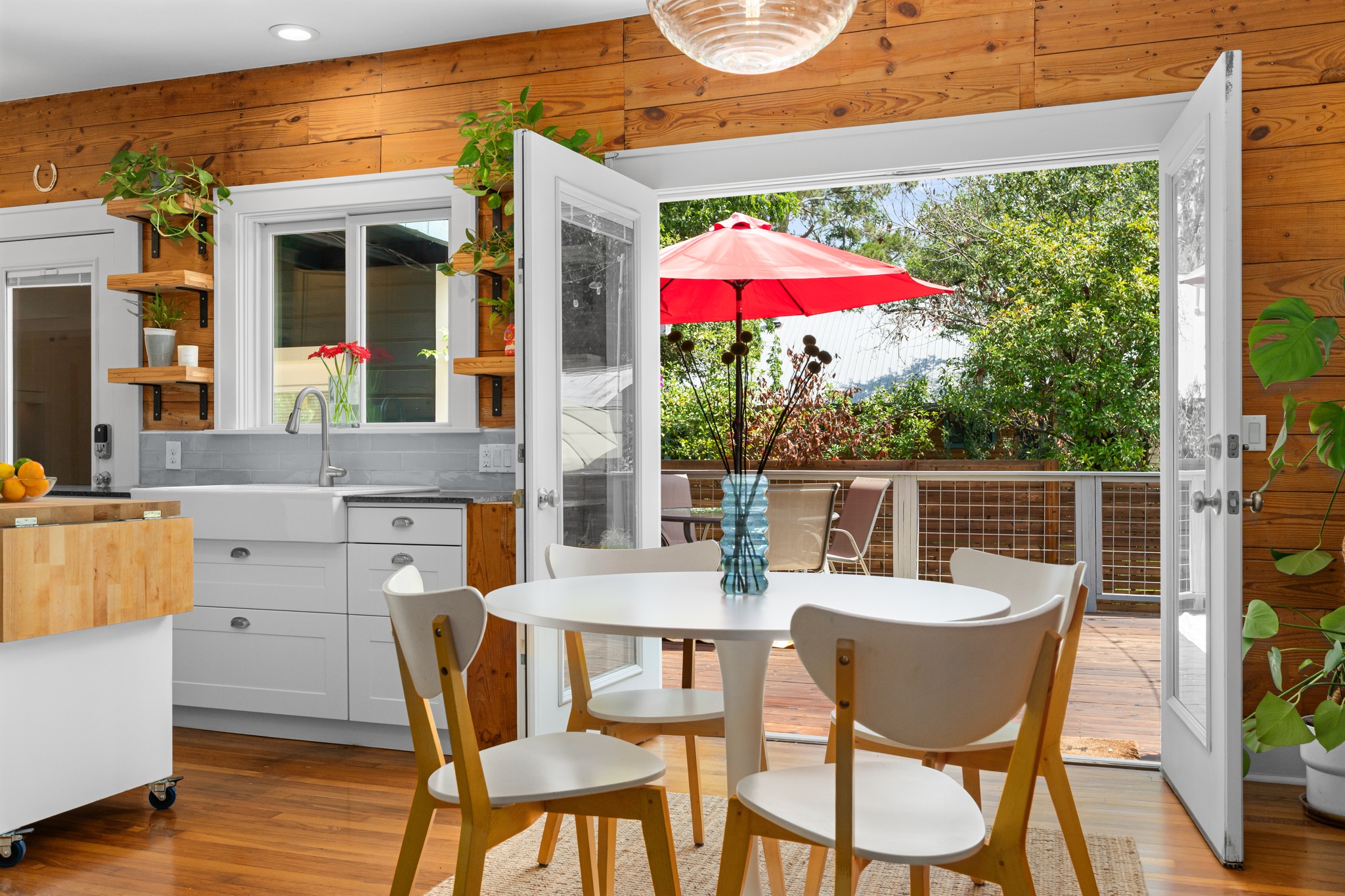 2215 Balboa Road Austin, TX 78733 - Photo 3 of 33 A vibrant indoor-outdoor flow connects this kitchen dining area with to outdoor deck.