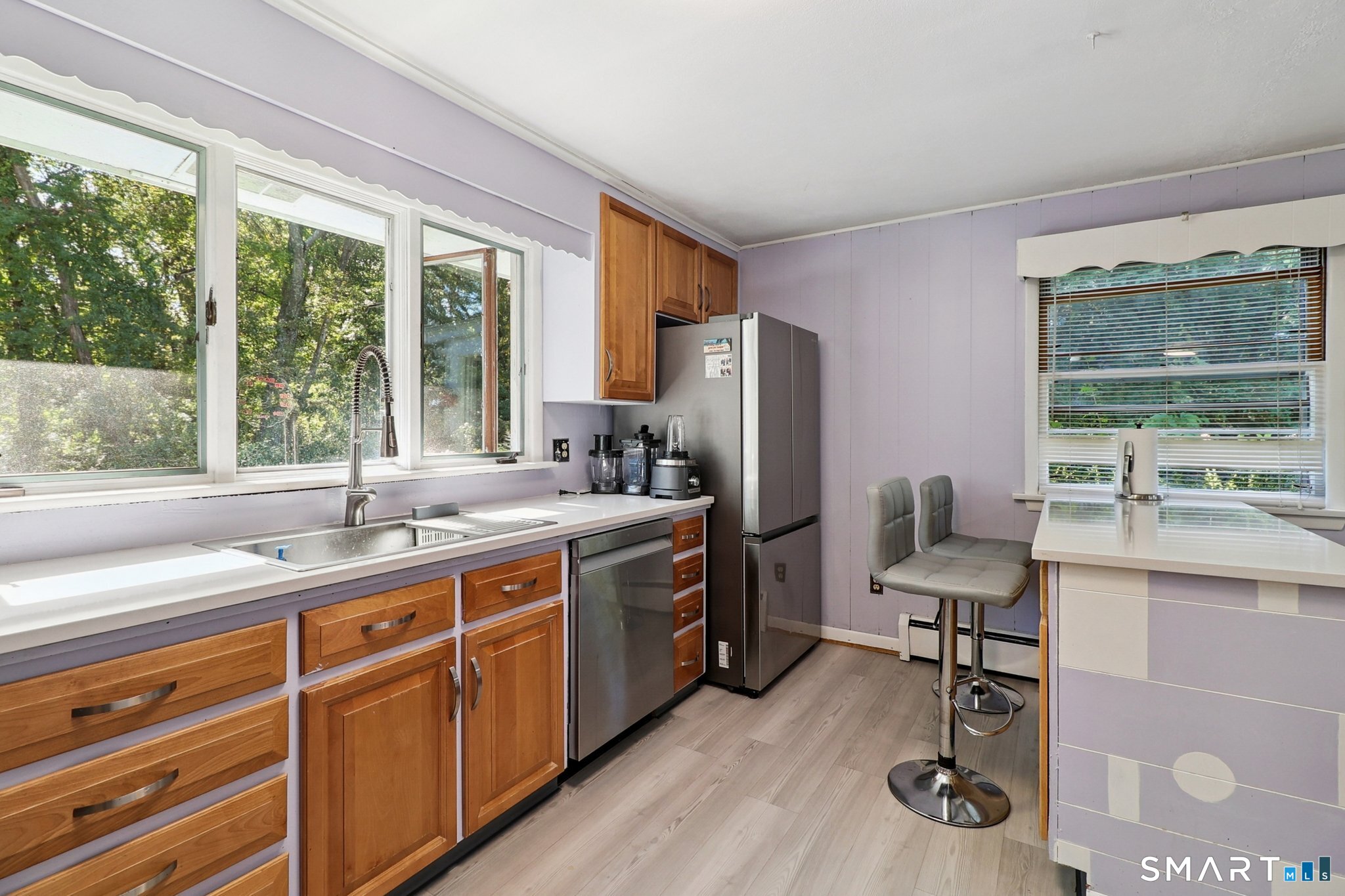 72 Hilltop Road Naugatuck, CT 06770 - Photo 11 of 25 a kitchen with a sink appliances and a large window