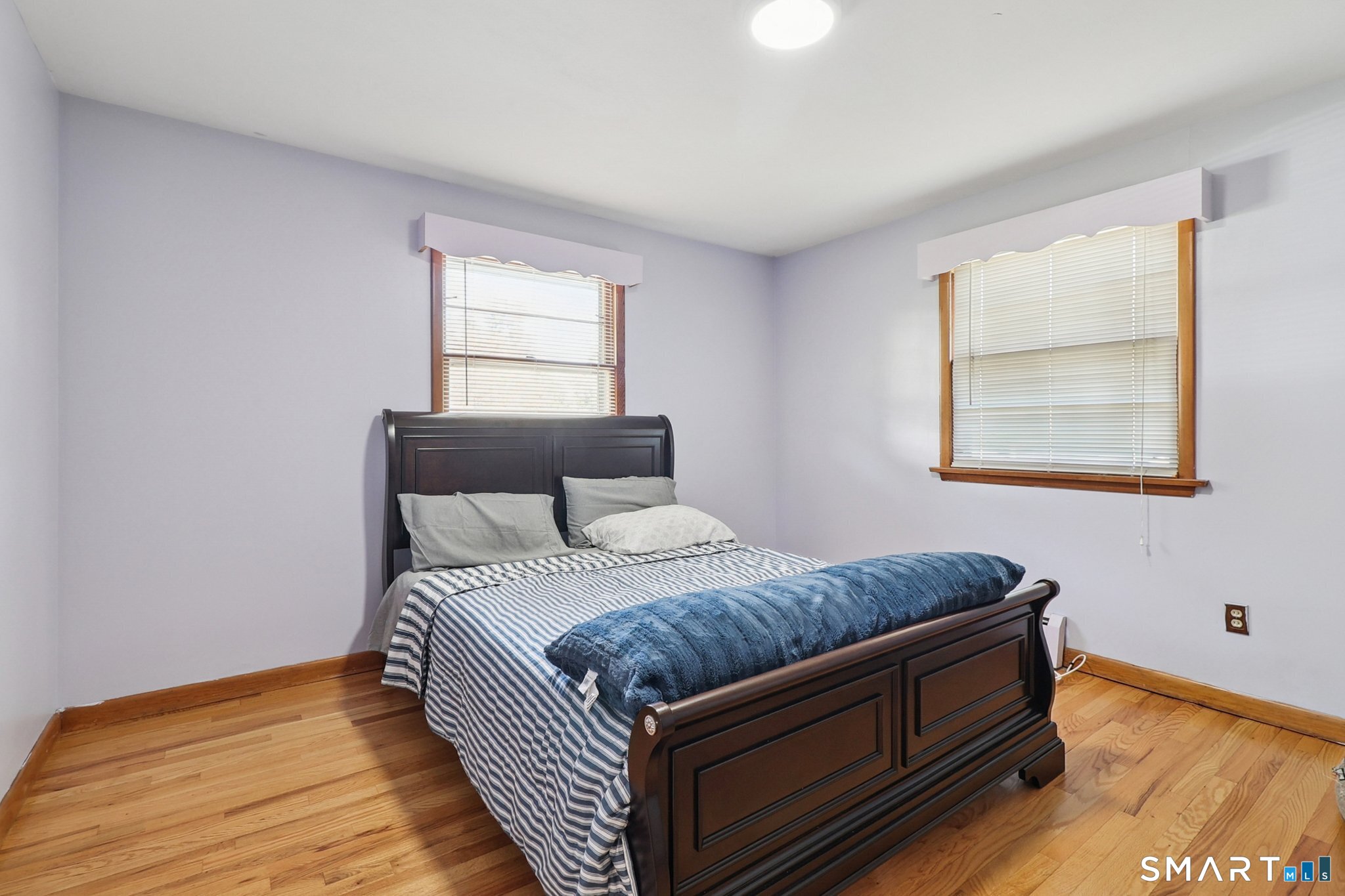 72 Hilltop Road Naugatuck, CT 06770 - Photo 12 of 25 a bedroom with a bed and wooden floor