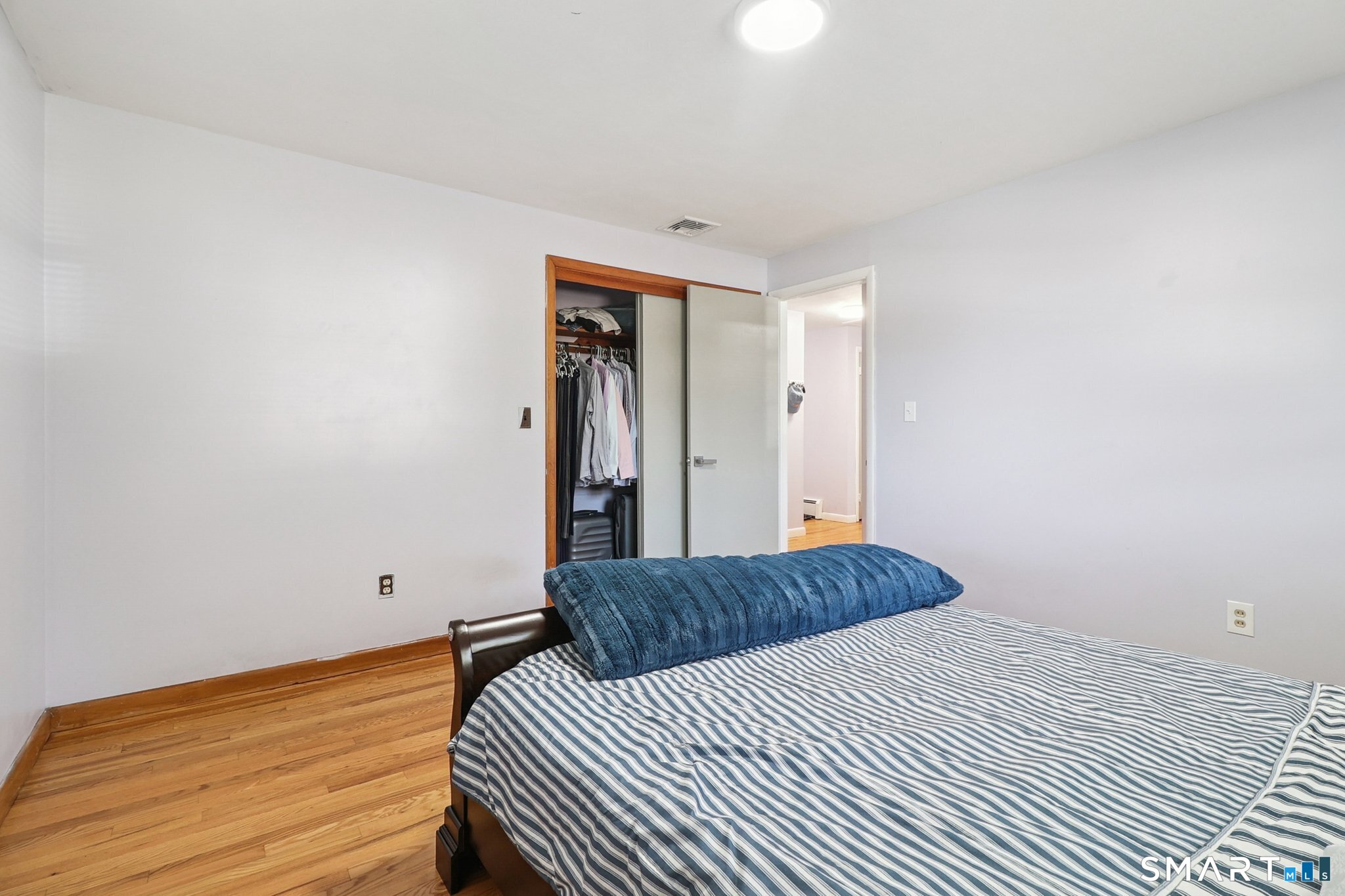 72 Hilltop Road Naugatuck, CT 06770 - Photo 13 of 25 a bedroom with a bed and wooden floor