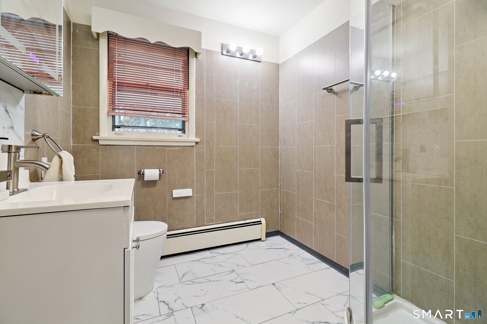 72 Hilltop Road Naugatuck, CT 06770 - Photo 16 of 25 a bathroom with a sink a toilet and shower