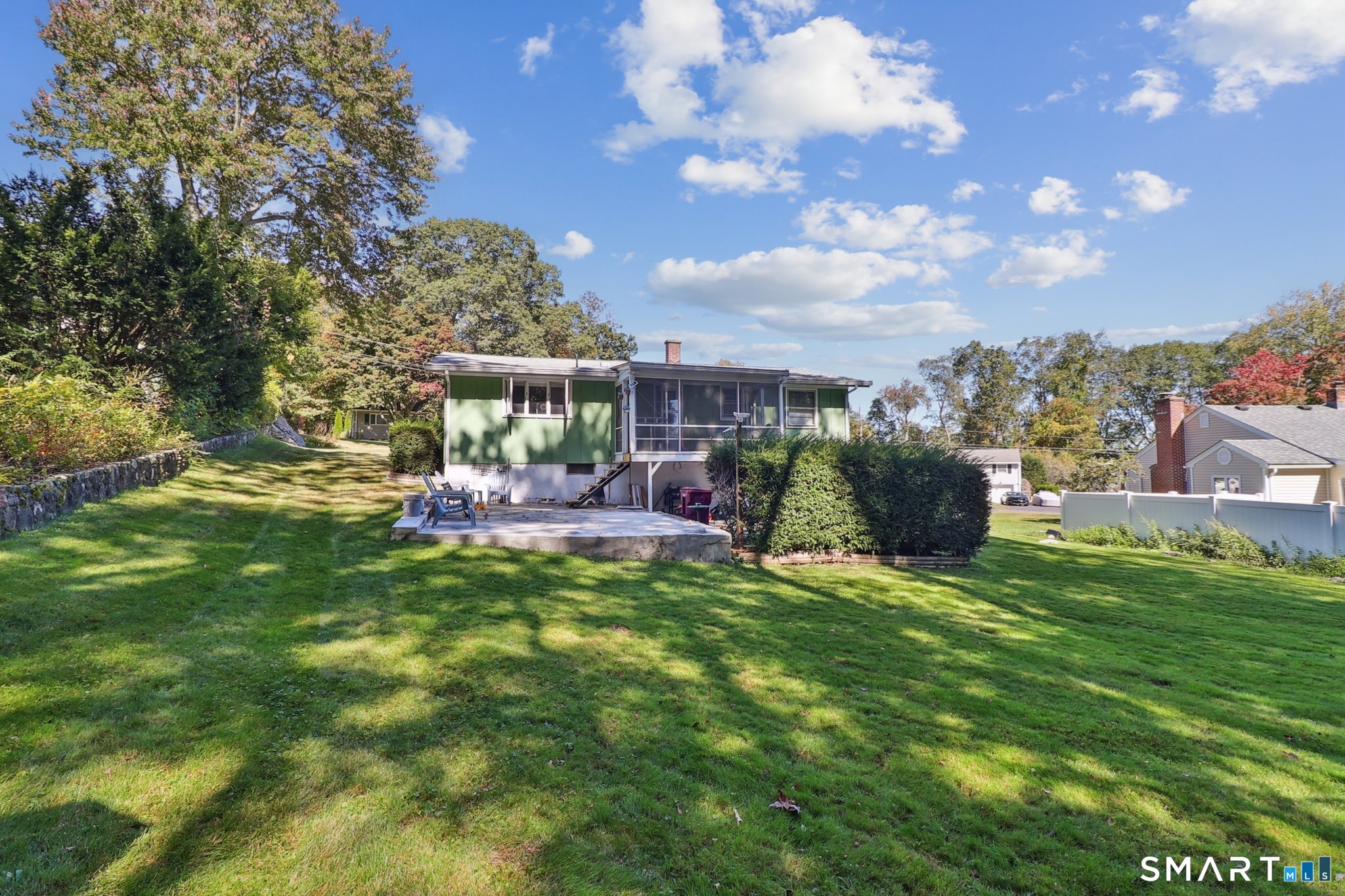 72 Hilltop Road Naugatuck, CT 06770 - Photo 25 of 25 a view of a house with a big yard potted plants and a large tree