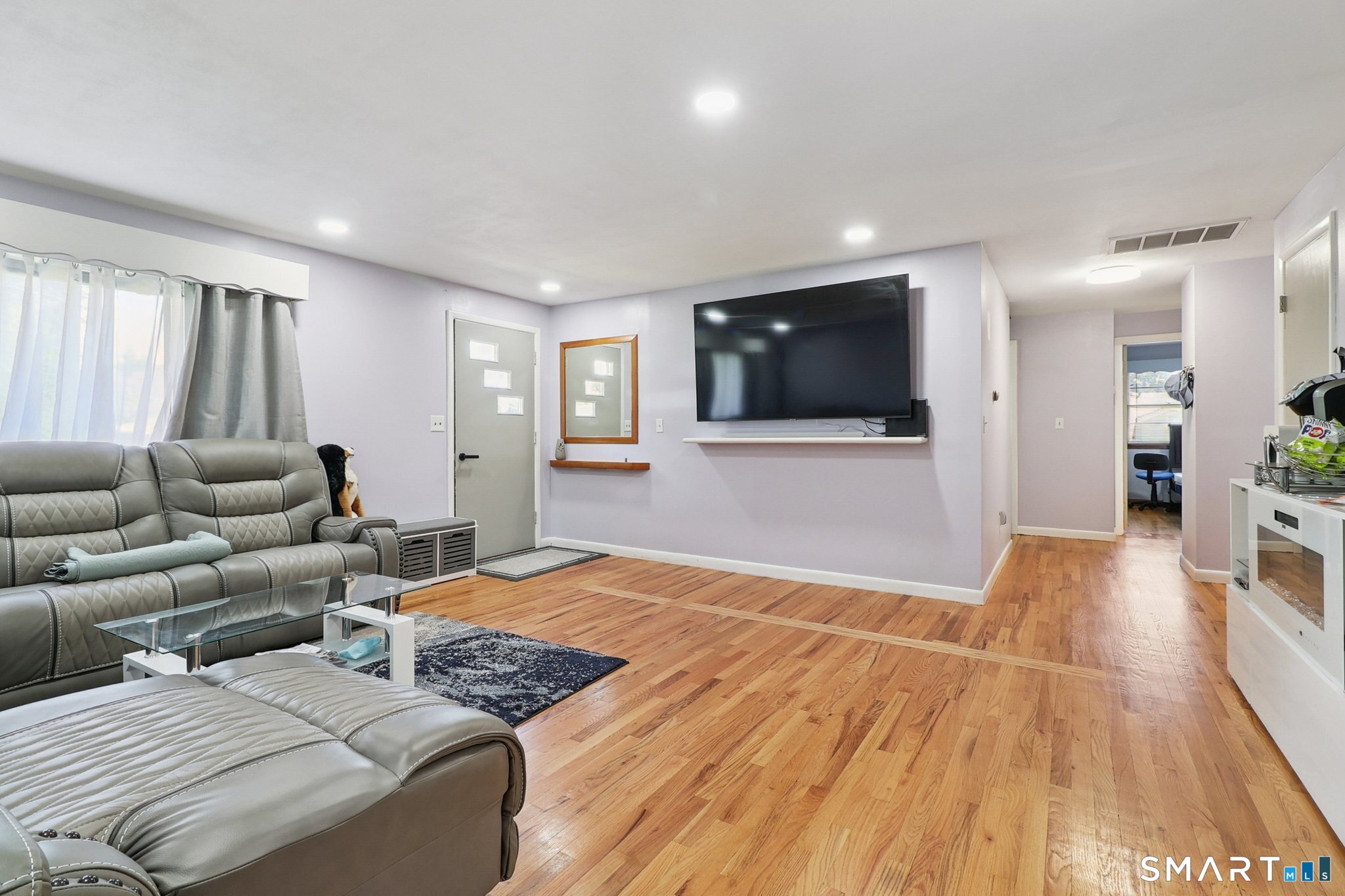 72 Hilltop Road Naugatuck, CT 06770 - Photo 7 of 25 a living room with couches and a flat screen tv