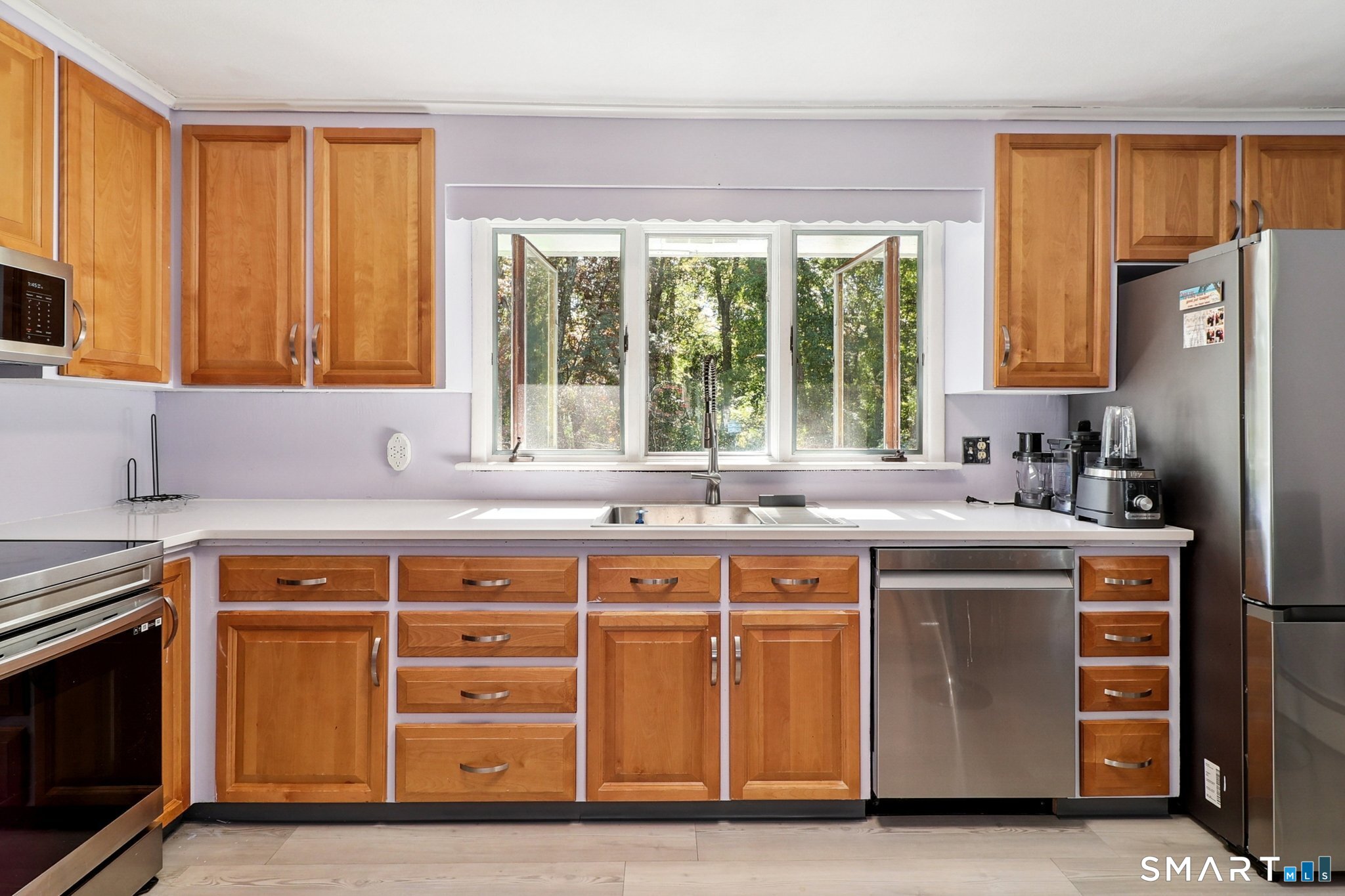 72 Hilltop Road Naugatuck, CT 06770 - Photo 10 of 25 a kitchen with a stove a sink and a refrigerator