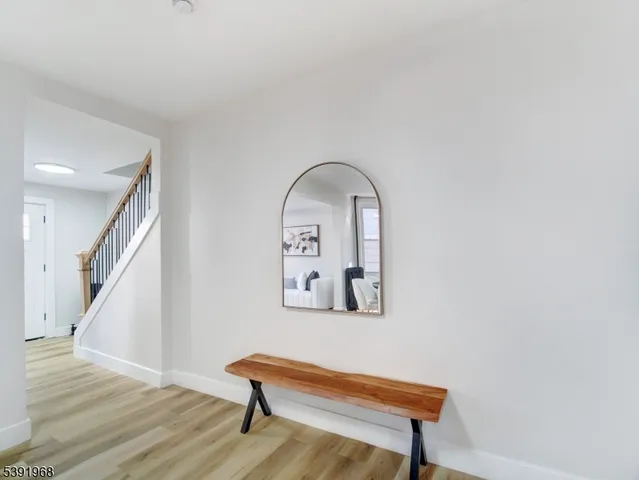 a living room with furniture a window and a fireplace