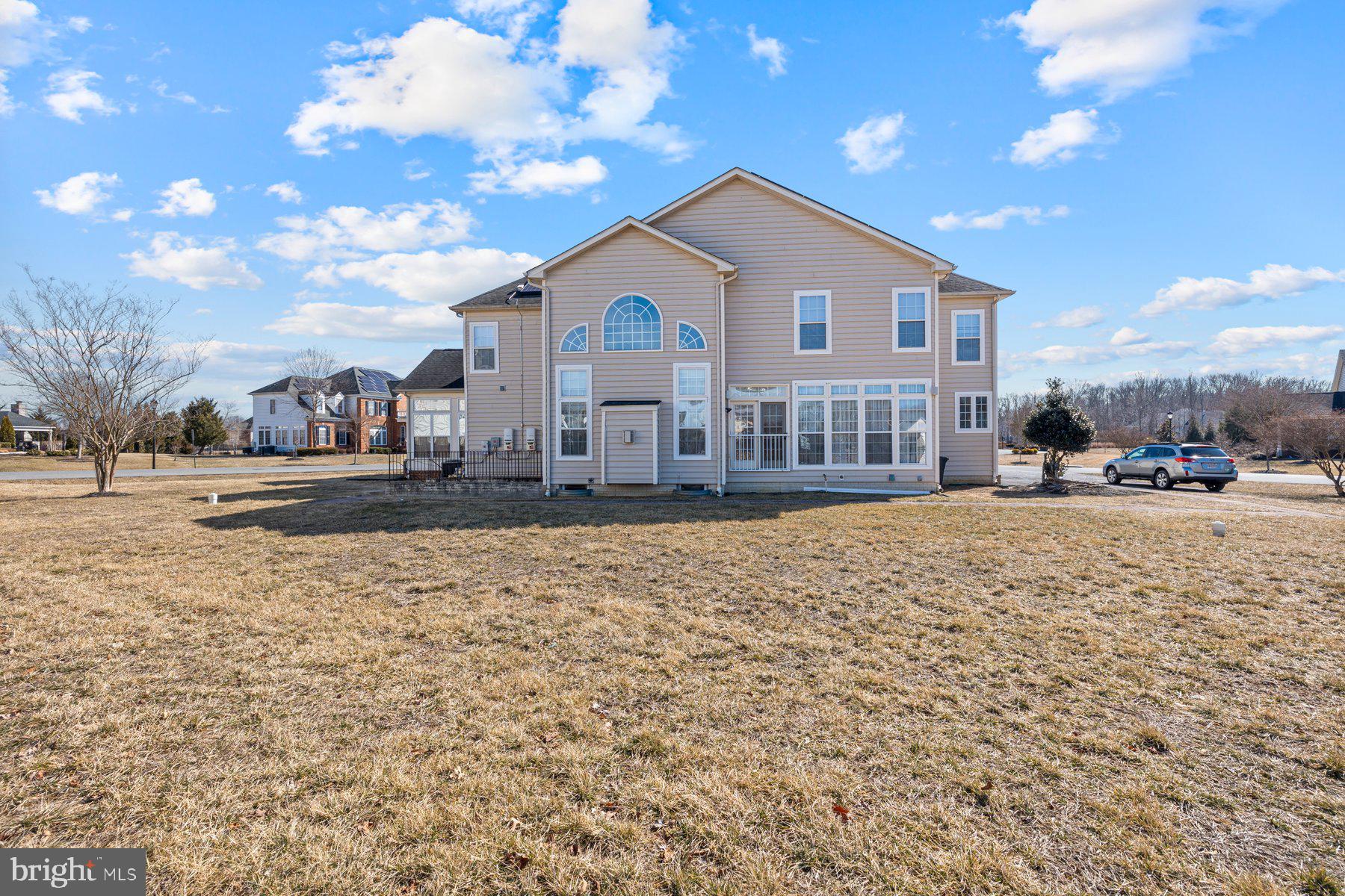 14206 Derby Ridge Road Bowie, MD 20721 - Photo 12 of 77 a view of a white house with a yard