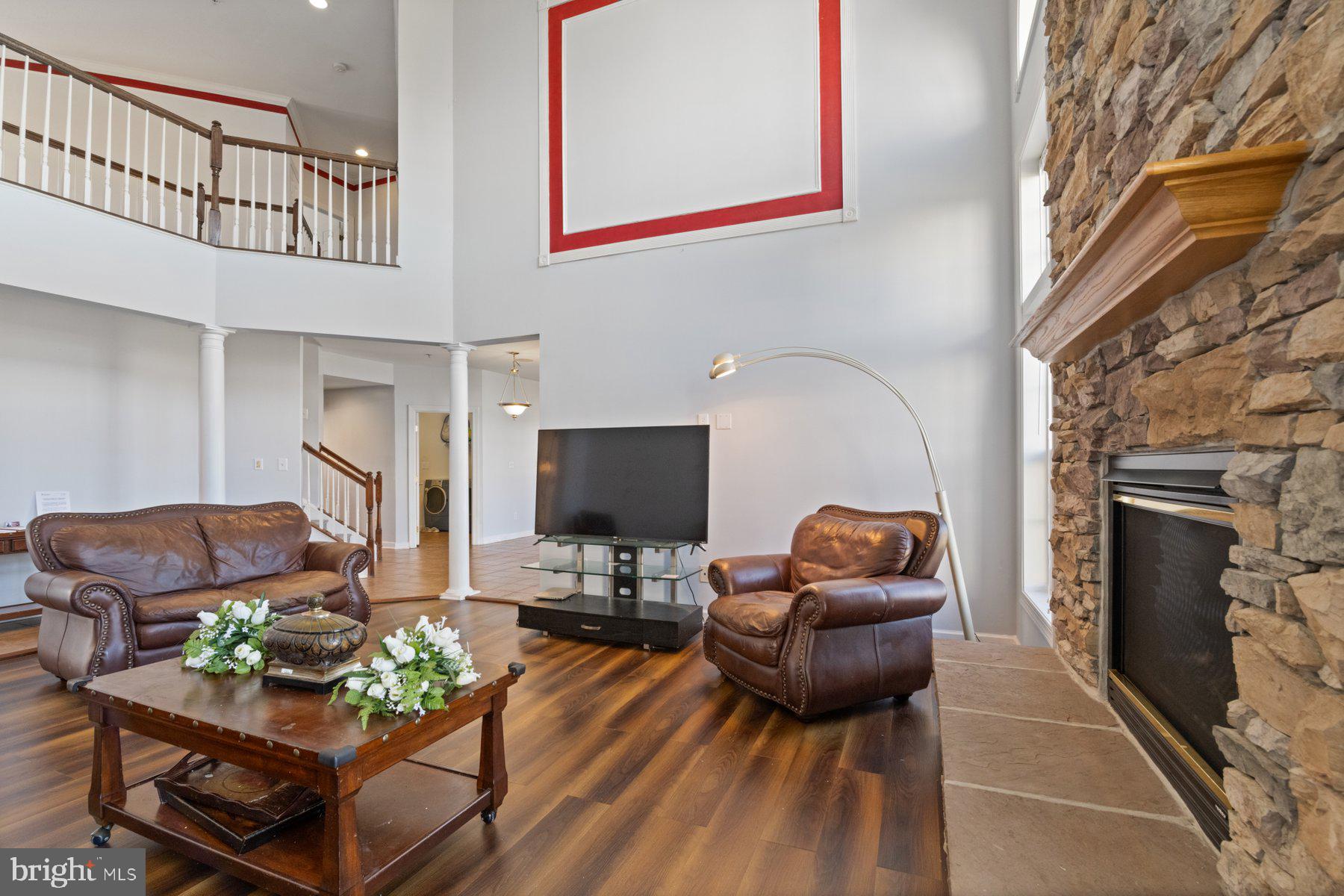 14206 Derby Ridge Road Bowie, MD 20721 - Photo 15 of 77 a living room with furniture and a fireplace