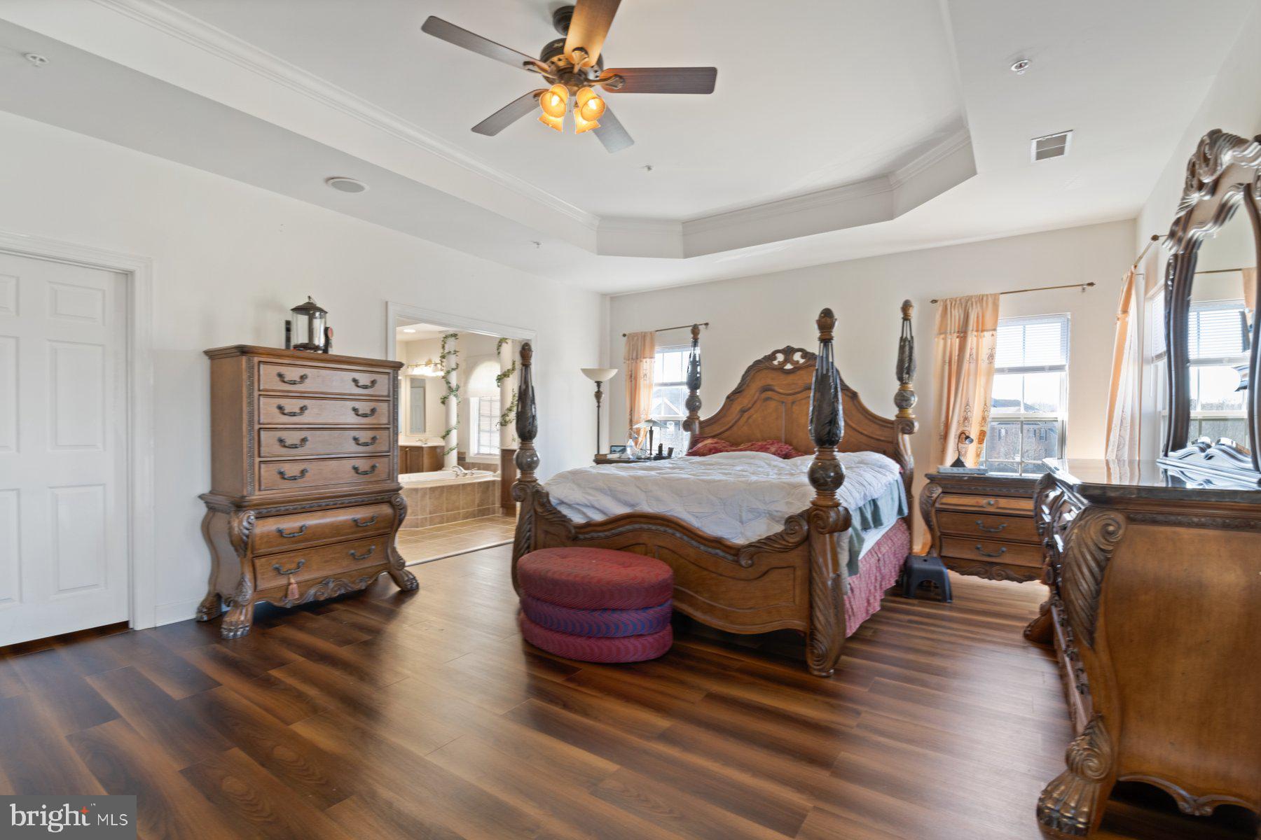 14206 Derby Ridge Road Bowie, MD 20721 - Photo 33 of 77 a bedroom with a bed and wooden floor