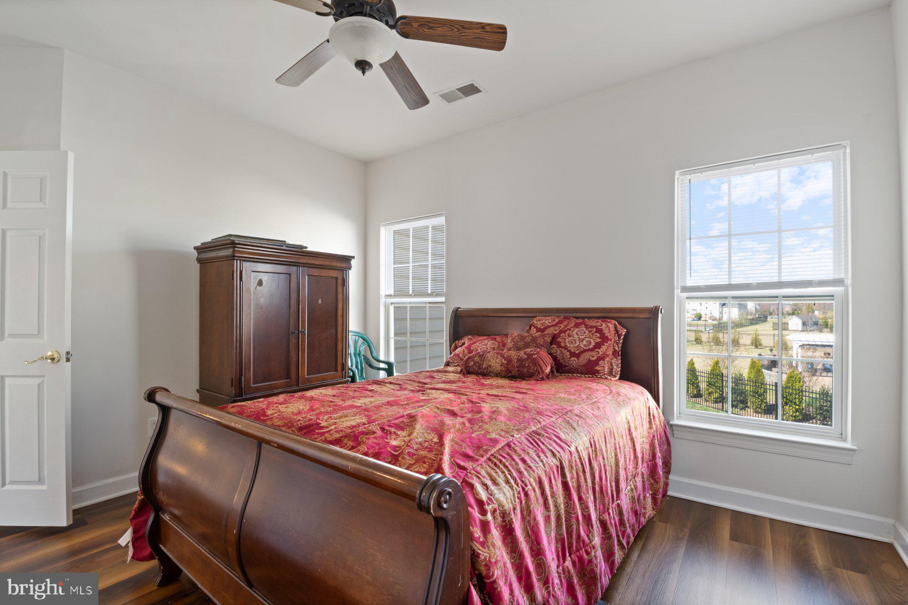 14206 Derby Ridge Road Bowie, MD 20721 - Photo 46 of 77 a bedroom with a bed and wooden floor