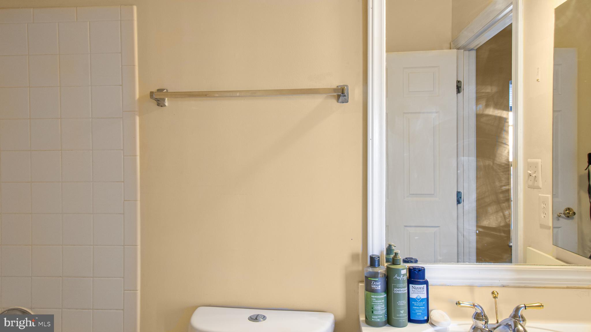 14206 Derby Ridge Road Bowie, MD 20721 - Photo 59 of 77 a bathroom with a shower and a mirror