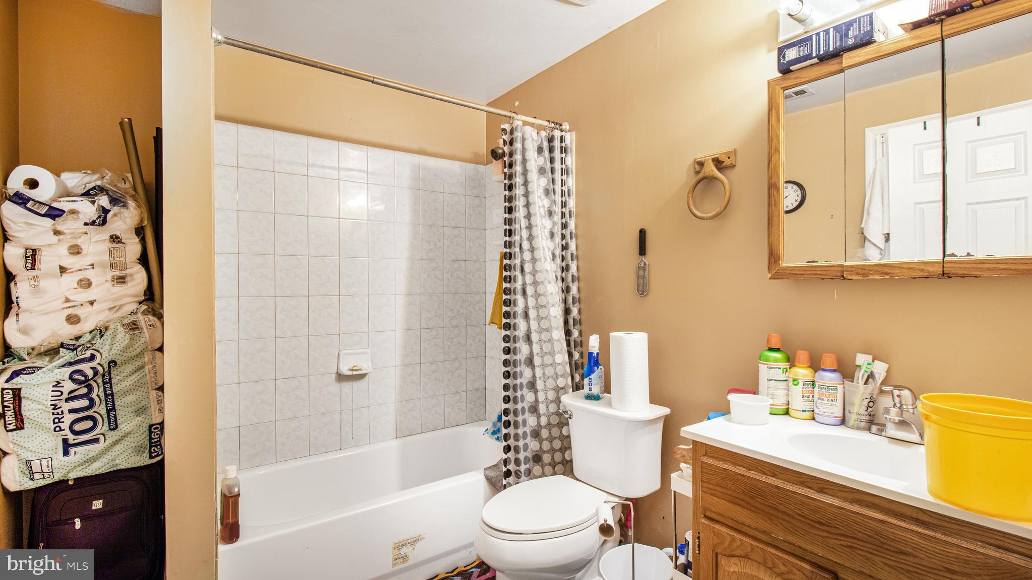 14206 Derby Ridge Road Bowie, MD 20721 - Photo 60 of 77 a bathroom with a sink a toilet and shower