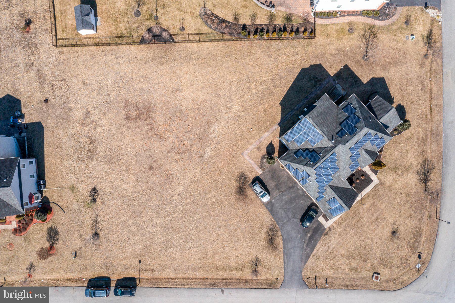 14206 Derby Ridge Road Bowie, MD 20721 - Photo 9 of 77 an aerial view of a house with a yard and lake view