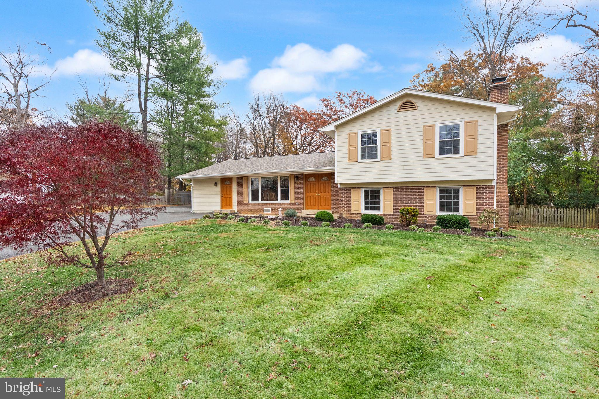 8522 Tysons Court Vienna, VA 22182 - Photo 1 of 27 a front view of a house with a yard