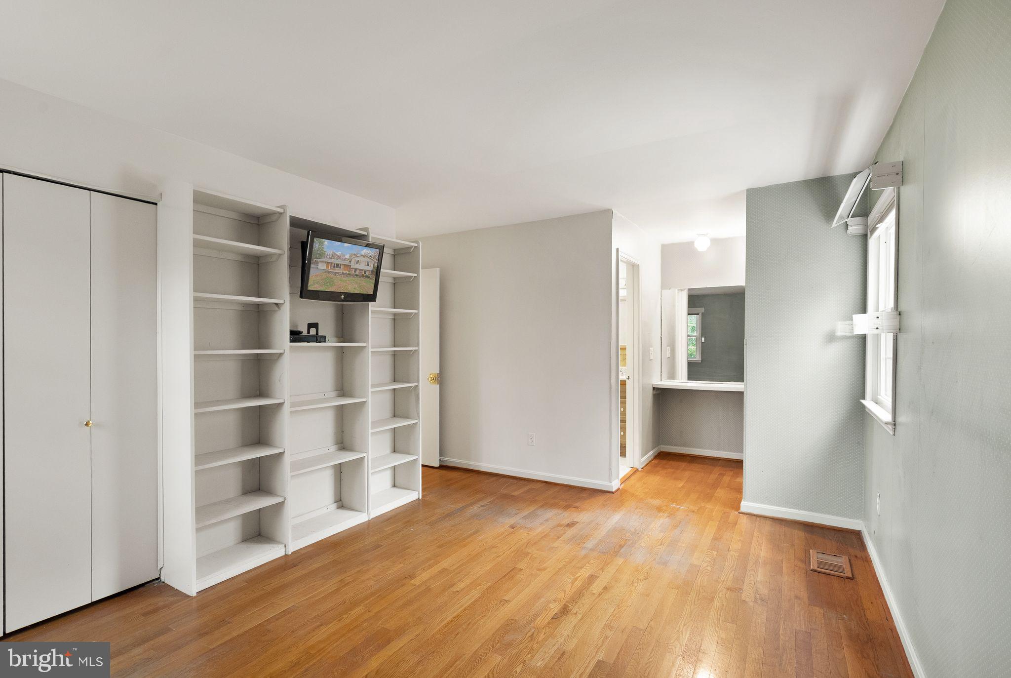 8522 Tysons Court Vienna, VA 22182 - Photo 11 of 27 a view of wooden floor and windows in a room
