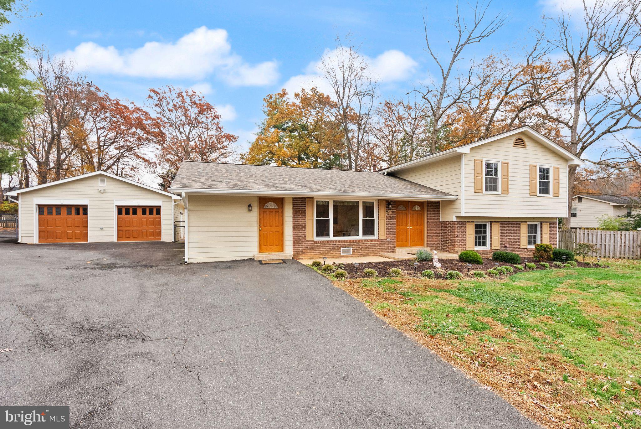 8522 Tysons Court Vienna, VA 22182 - Photo 2 of 27 a front view of a house with a yard