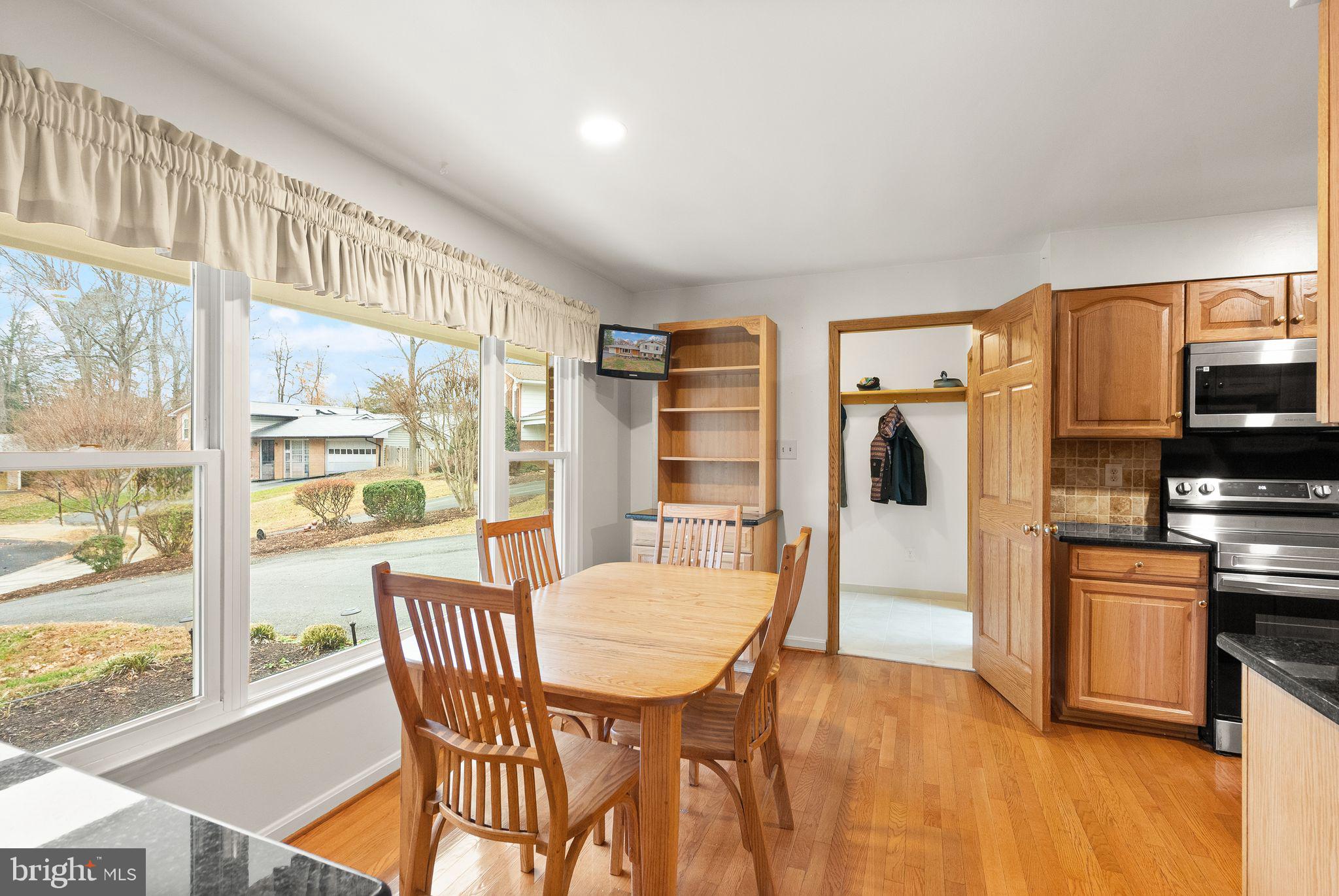 8522 Tysons Court Vienna, VA 22182 - Photo 3 of 27 a view of a dining room with furniture window and wooden floor