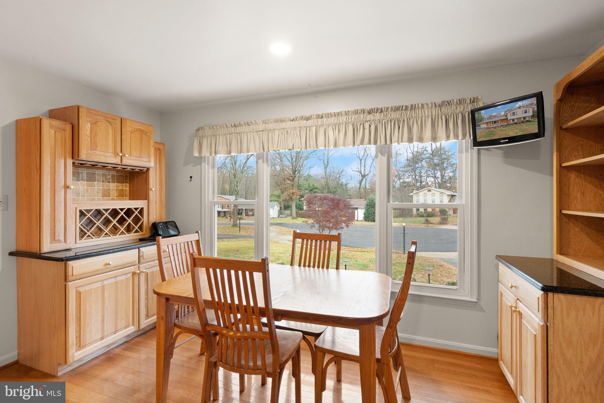 8522 Tysons Court Vienna, VA 22182 - Photo 4 of 27 a dining room with furniture and a floor to ceiling window