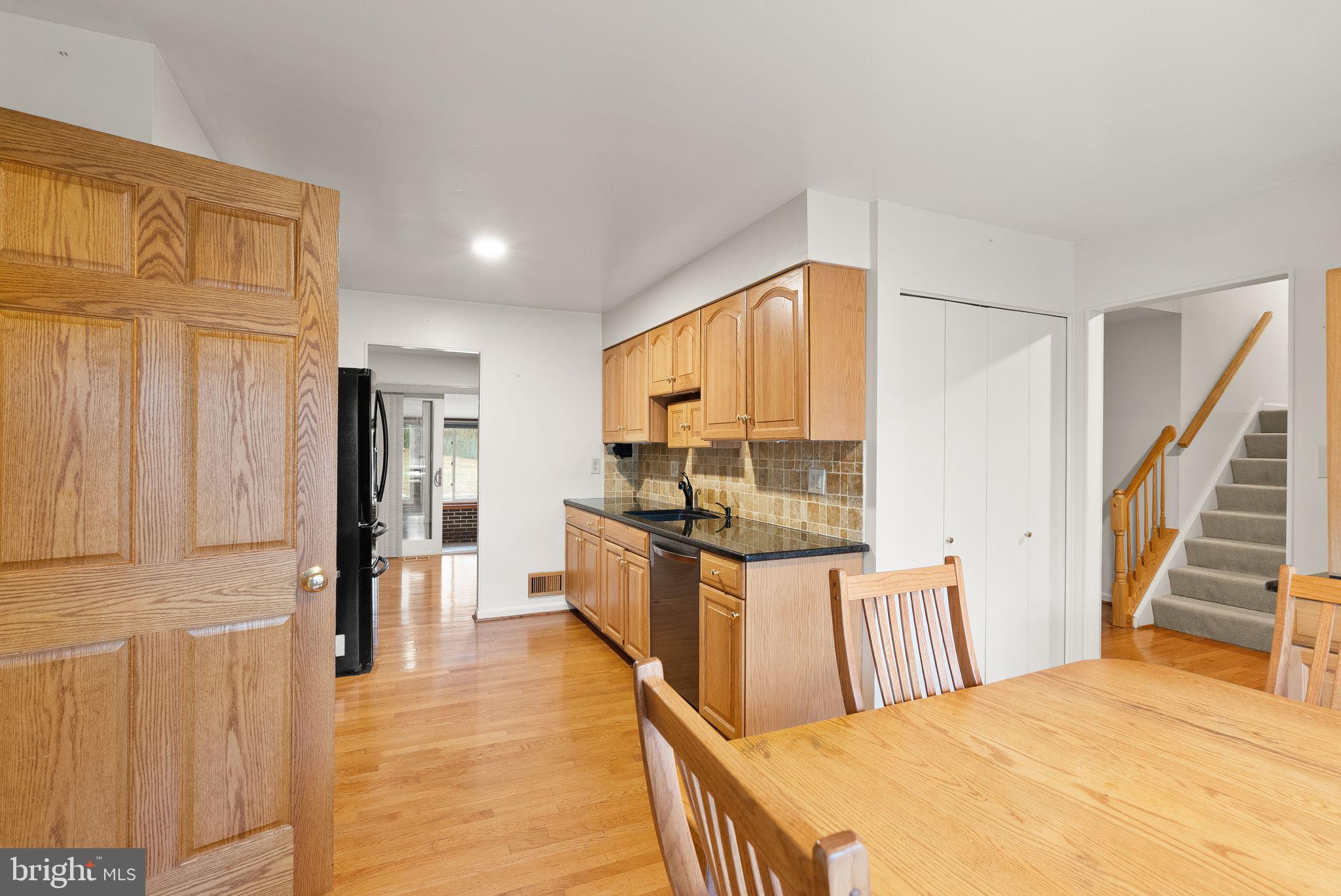 8522 Tysons Court Vienna, VA 22182 - Photo 5 of 27 a large bedroom with a large bed and a large window