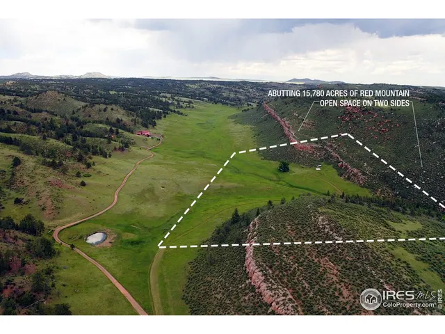a open area with mountains in the background