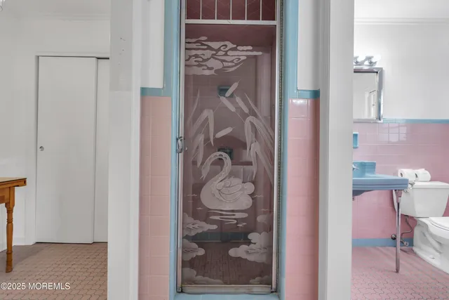 a view of a bedroom with a door and chair