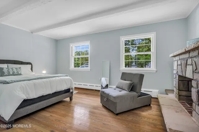 a spacious bedroom with a bed and window