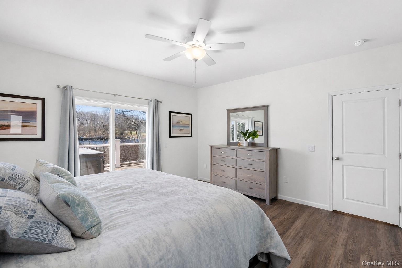 2280 Deep Hole Drive Mattituck, NY 11952 - Photo 10 of 35 Primary ensuite with large walk in closets and access to balcony