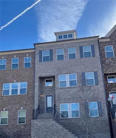a front view of a building with glass windows