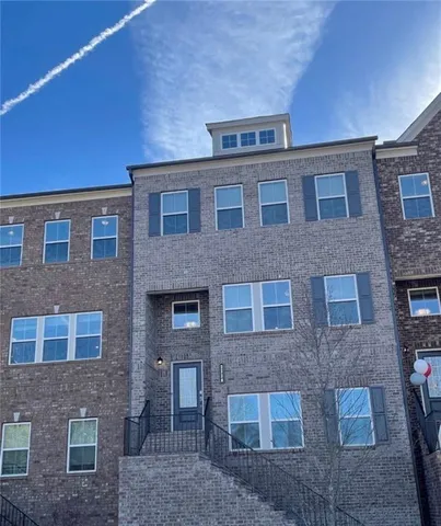 a front view of a building with glass windows
