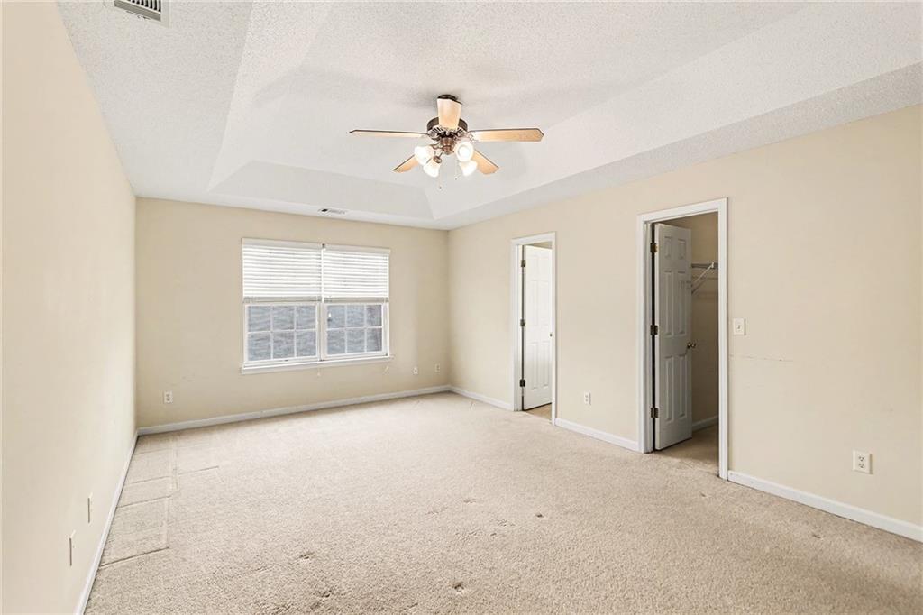 7676 Rutgers Circle Fairburn, GA 30213 - Photo 19 of 33 a view of an empty room with a window