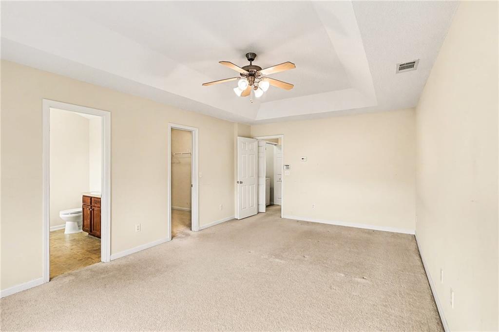 7676 Rutgers Circle Fairburn, GA 30213 - Photo 21 of 33 a view of a livingroom with a ceiling fan and window