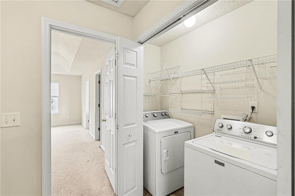 7676 Rutgers Circle Fairburn, GA 30213 - Photo 27 of 33 a view of bathroom with a washer and dryer