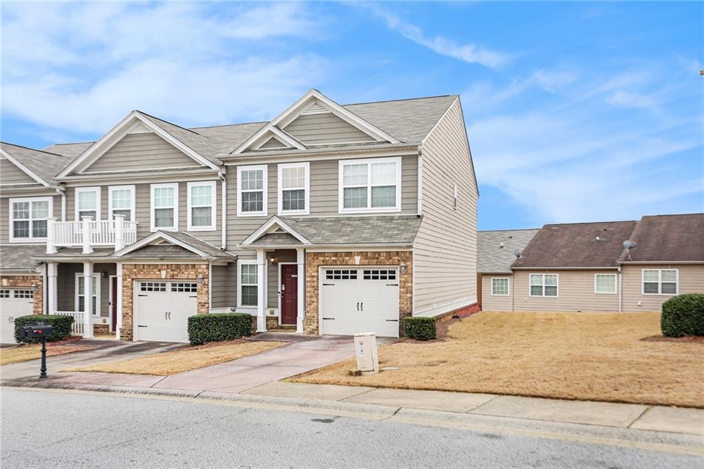 7676 Rutgers Circle Fairburn, GA 30213 - Photo 3 of 33 a front view of a house with a yard
