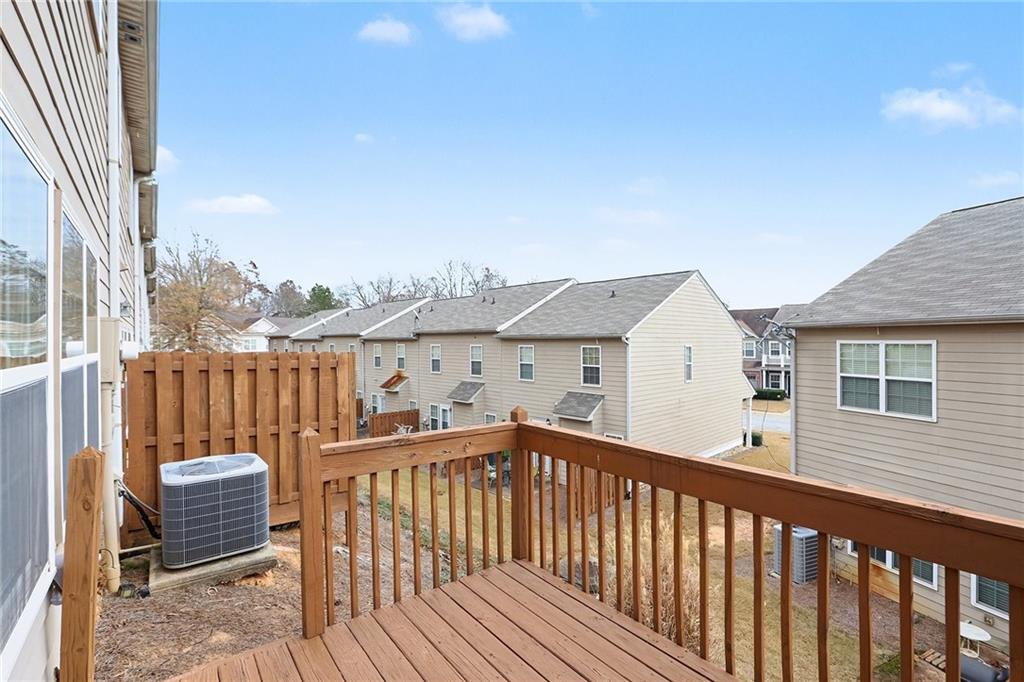 7676 Rutgers Circle Fairburn, GA 30213 - Photo 31 of 33 a view of a balcony with wooden fence