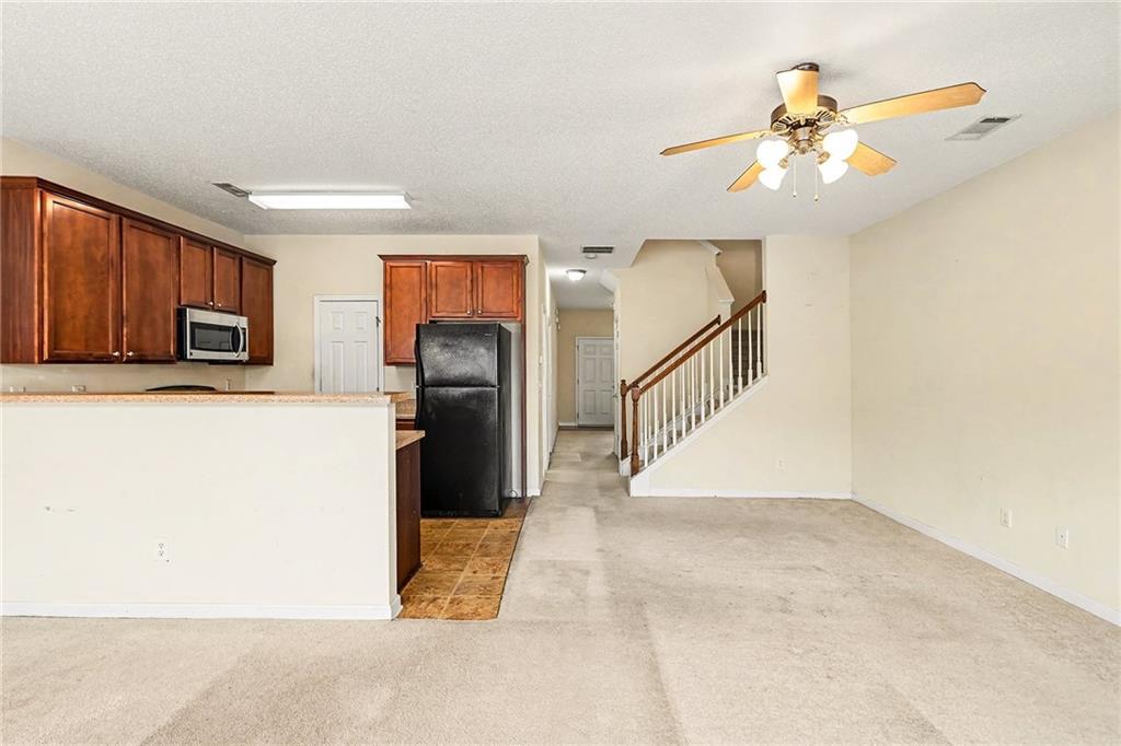 7676 Rutgers Circle Fairburn, GA 30213 - Photo 10 of 33 a view of a kitchen with a sink