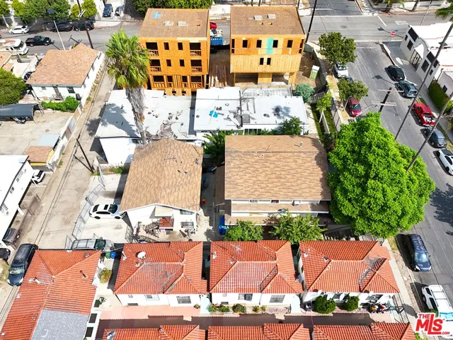 an aerial view of residential houses with outdoor space