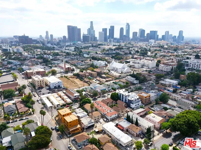 an aerial view of a city with tall buildings