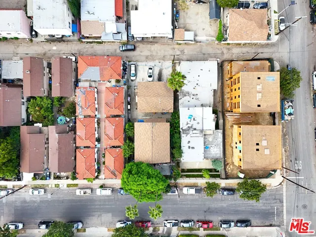 an aerial view of multiple houses with outdoor space