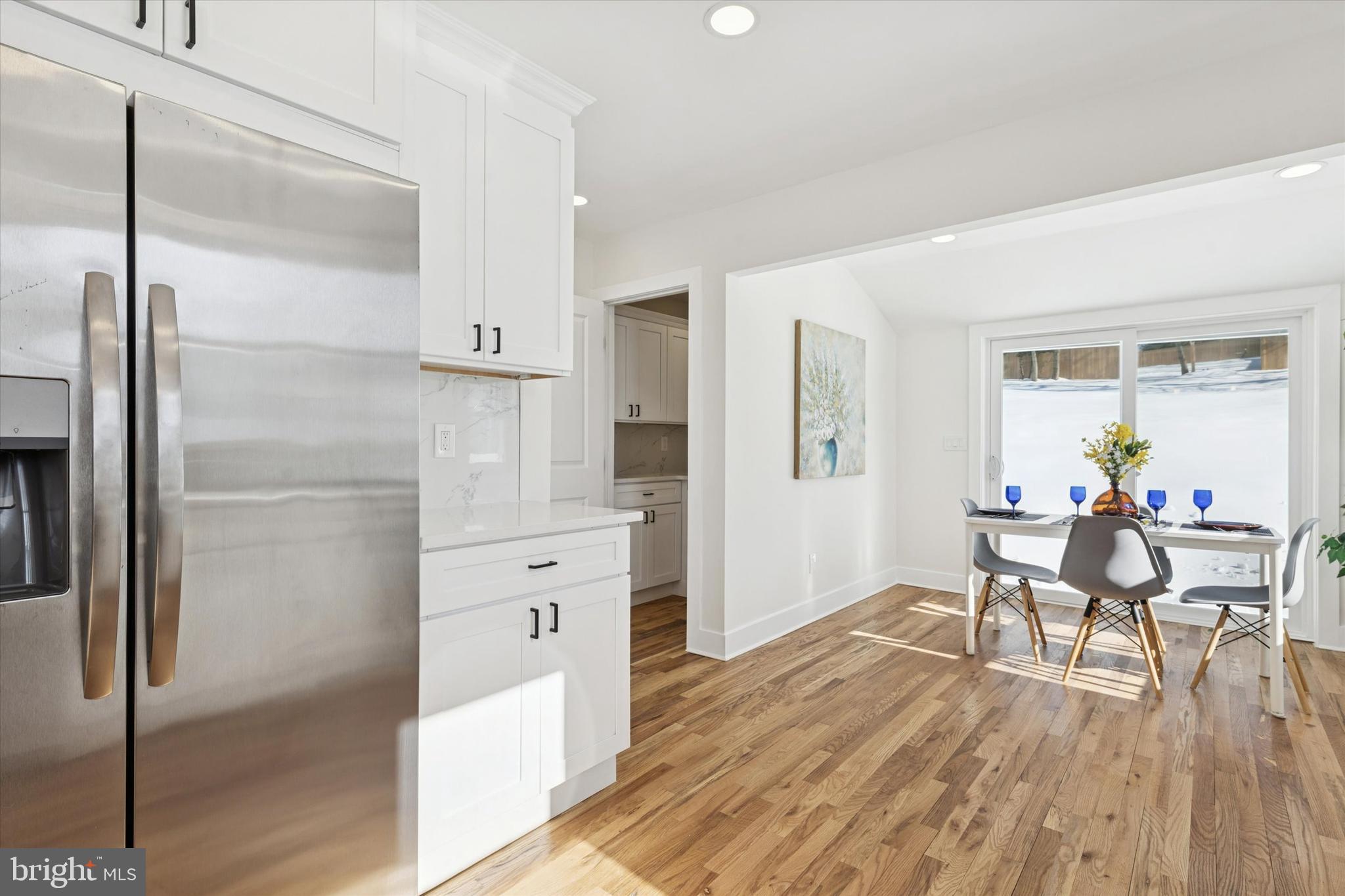 624 Convent Road Aston, PA 19014 - Photo 12 of 26 a kitchen with white cabinets and stainless steel appliances