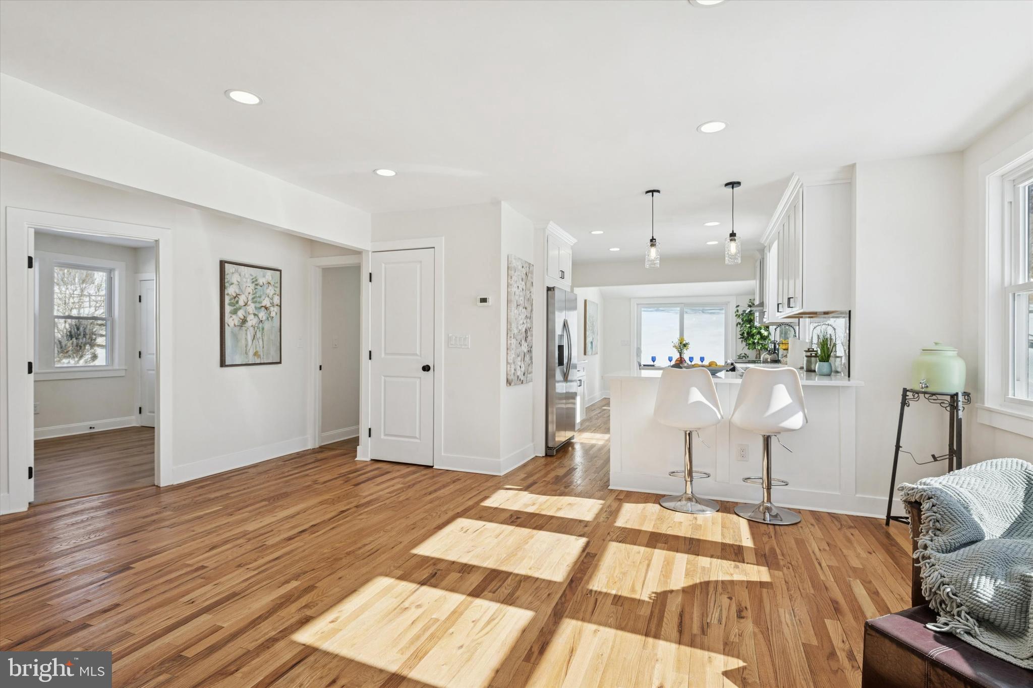 624 Convent Road Aston, PA 19014 - Photo 5 of 26 a view of a living room and kitchen with wooden floor