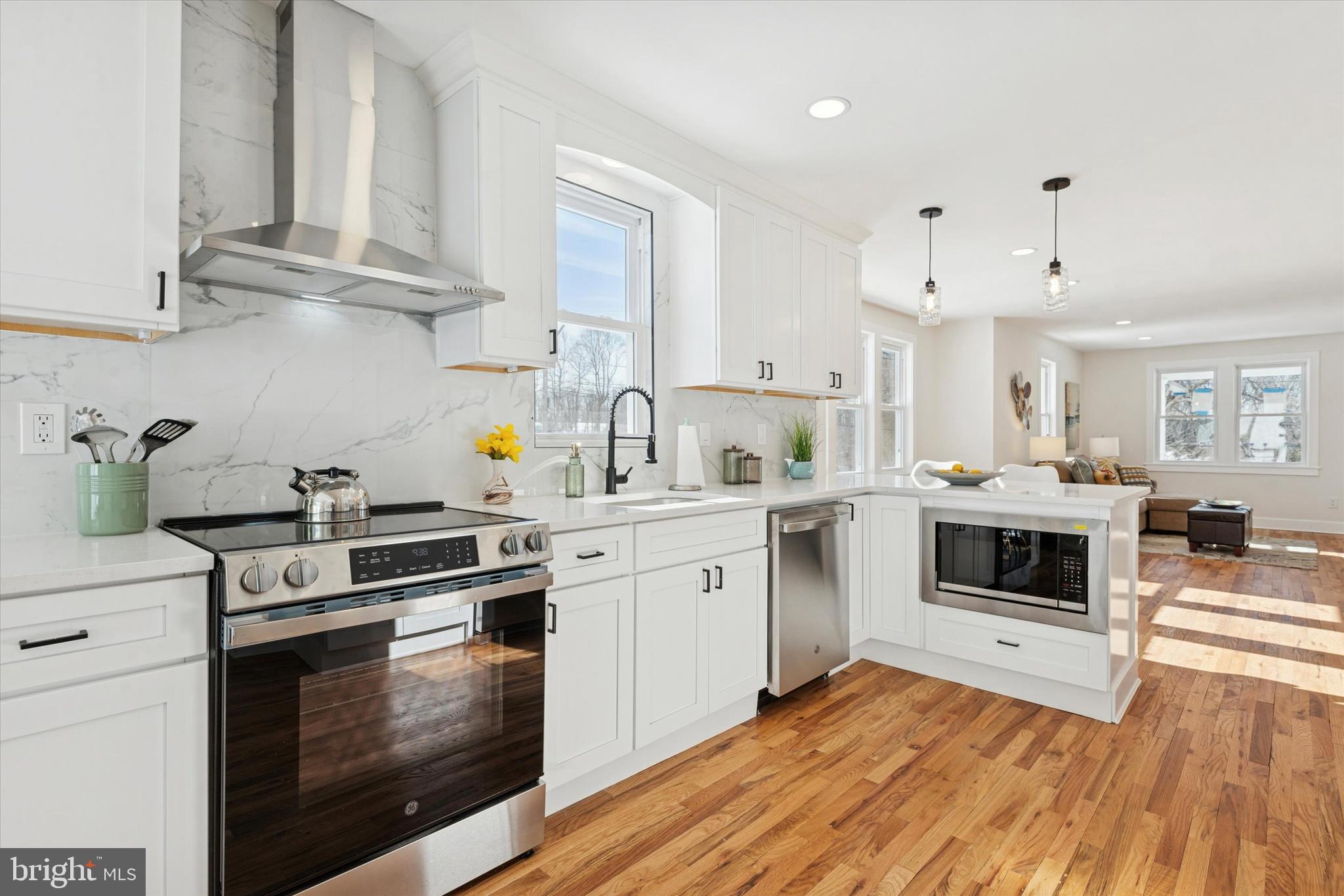 624 Convent Road Aston, PA 19014 - Photo 10 of 26 a kitchen with cabinets appliances and a wooden floor