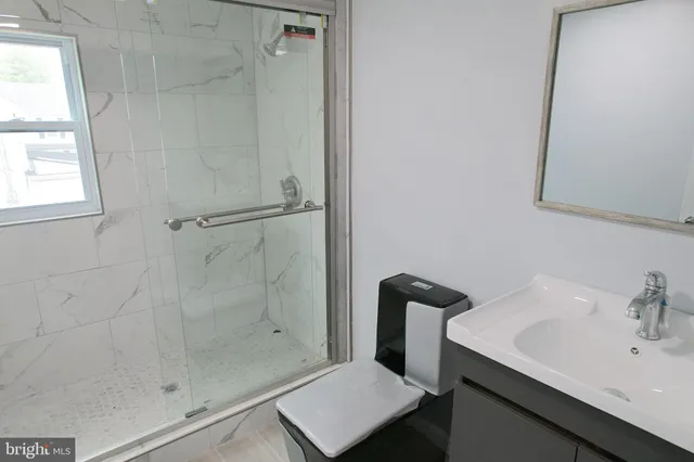 a bathroom with a sink and a shower