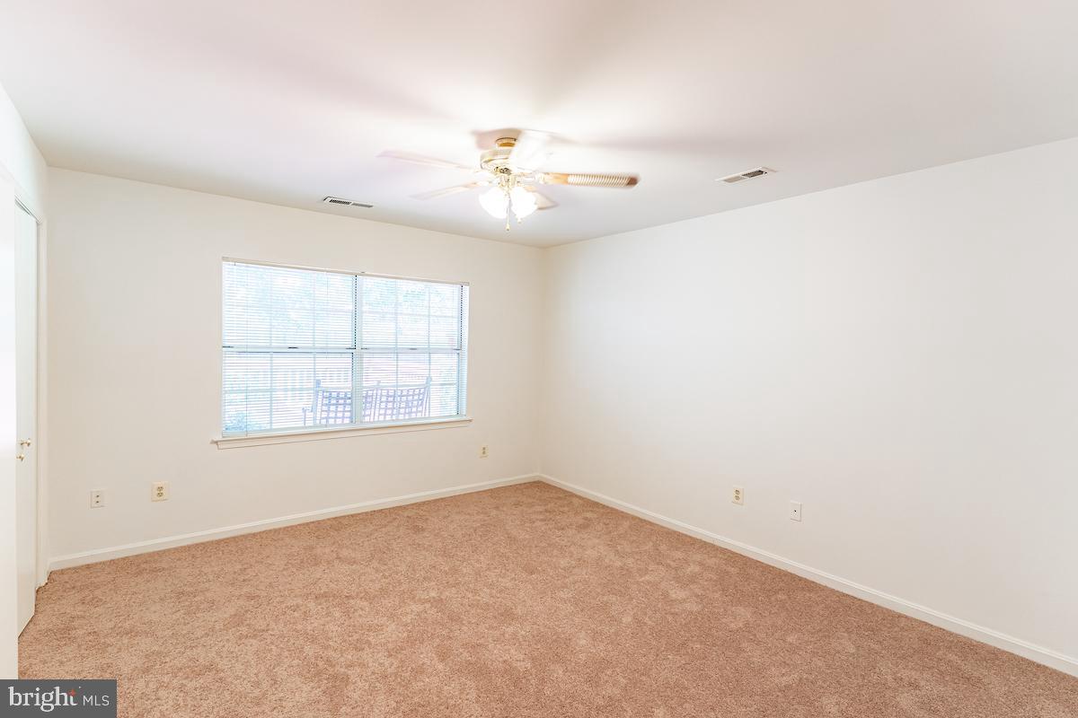 9268 Cherry Lane, Unit 57 Laurel, MD 20708 - Photo 11 of 33 Bedroom with lighting and ceiling fan